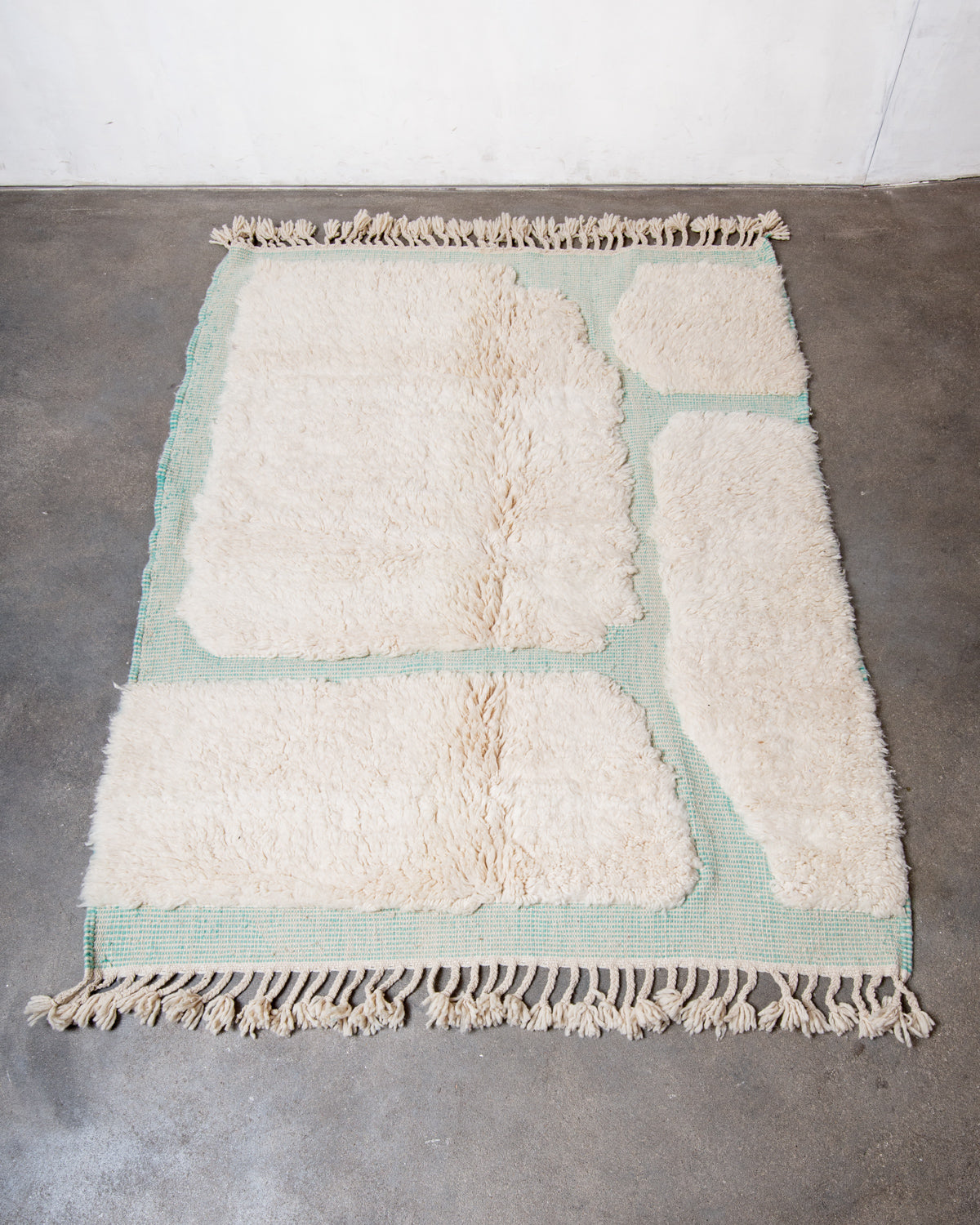 Modern, designer, handcrafted Berber rug from Morocco. Beniourain carpet with minimalist design, natural wool pile and a fluffy texture.